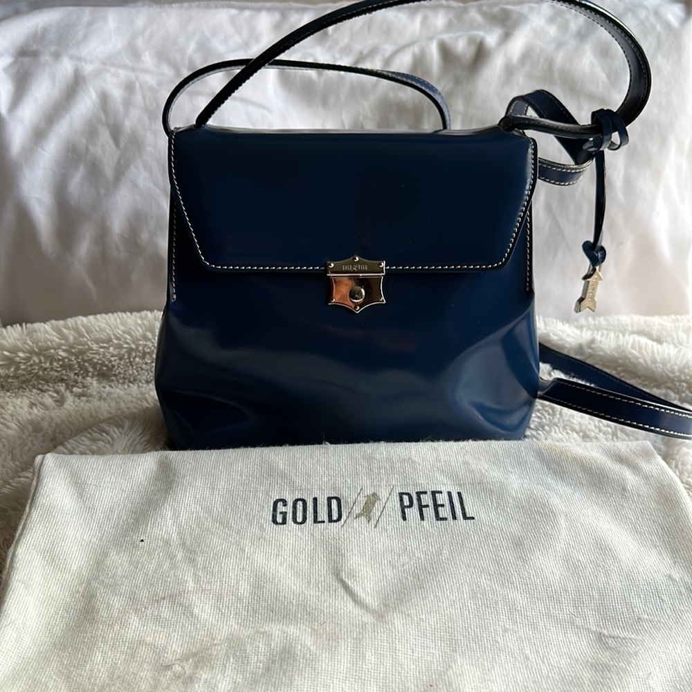 Gold Pfeil purse.